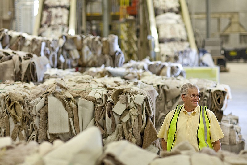 CUTLINE: Dalton, Ga.-based Shaw Industries will build a $17 million carpet recycling center in a former Ringgold, Ga. distribution facility, with plans to go operational in 2015. The flooring manufacturer says it has recycled more than 700 million pounds of carpet since it began its voluntary program in 2006. 