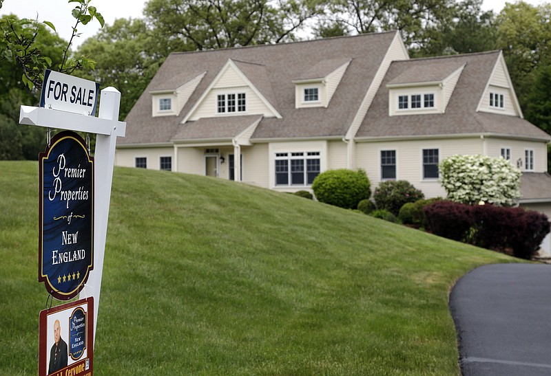 
              This Tuesday, May 24, 2016, photo shows a house for sale in North Andover, Mass. On Thursday, July 14, 2016, Freddie Mac reports on the week’s average U.S. mortgage rates. (AP Photo/Elise Amendola)
            