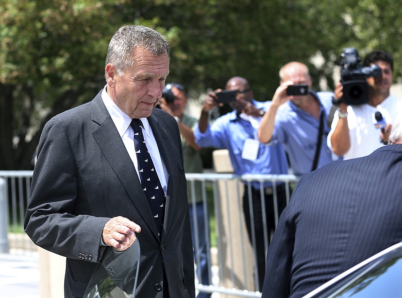 
              David Samson, center, former Port Authority of New York and New Jersey chairman, leaves Federal Court after a hearing Thursday, July 14, 2016, in Newark, N.J. Samson pleaded guilty Thursday to using his post to get United Airlines to run direct flights to South Carolina so that he could more easily visit his vacation home.(AP Photo/Mel Evans)
            