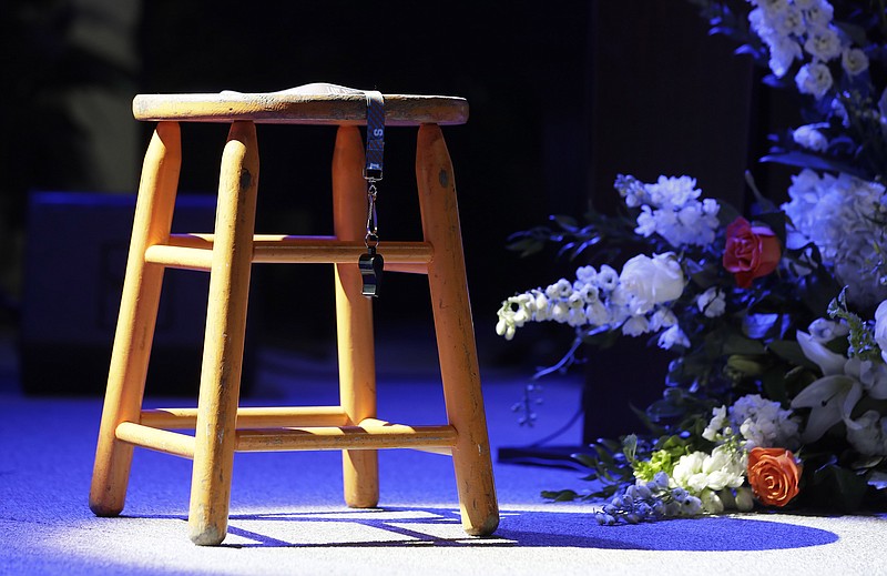 The stool and whistle used by Tennessee women's basketball coach Pat Summitt are displayed on the stage in Thompson-Boling Arena before a ceremony celebrating her life, Thursday, July 14, 2016, in Knoxville, Tenn. Summitt died June 28 at the age of 64. (AP Photo/Mark Humphrey, Pool)