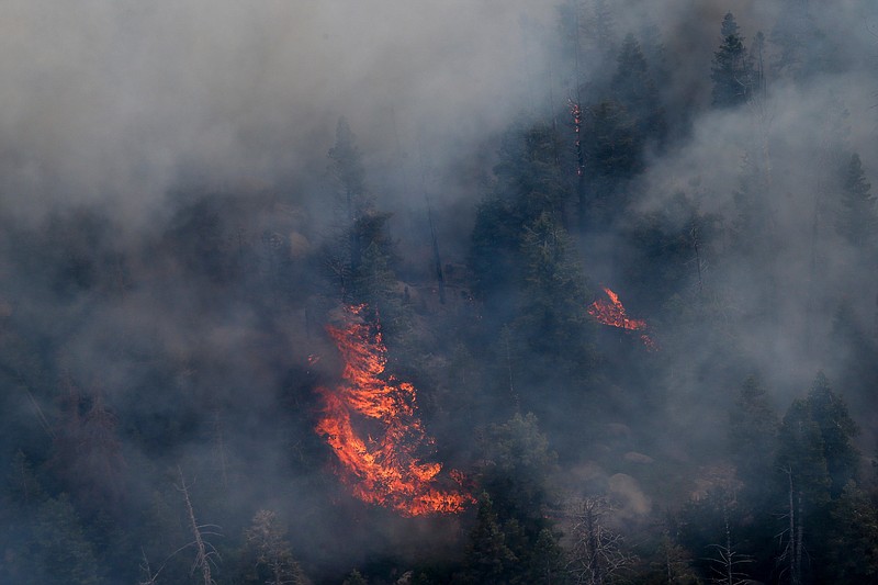 
              FILE - This June 21, 2016, file photo, crews continue to fight the Saddle Fire near Pine Valley, Utah. Utah lawmakers will consider whether to allow officials to damage or disable unauthorized drones flying over a wildfire and impose higher fines on people caught flying the aircraft. The proposal is one of a handful of bills legislators will vote on Wednesday, July 13, 2016, when they meet in a special legislative session. (Spenser Heaps/Deseret News via AP, File) /The Deseret News via AP)  SALT LAKE TRIBUNE OUT; MAGS OUT; MANDATORY CREDIT; TV OUT
            