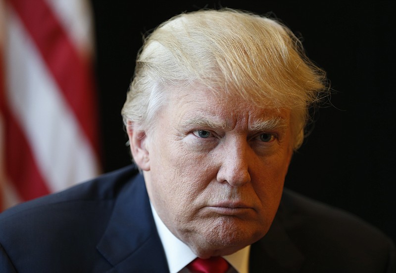 
              In this photo taken July 11, 2016, Republican Presidential candidate Donald Trump listens to a question during an interview in Virginia Beach, Va. In a summer of political and racial tumult, young Americans are in a dour mood: pessimistic about the fairness of the economic system, questioning the greatness of the U.S. and wondering about the effectiveness of how the nation picks its leaders. (AP Photo/Steve Helber)
            