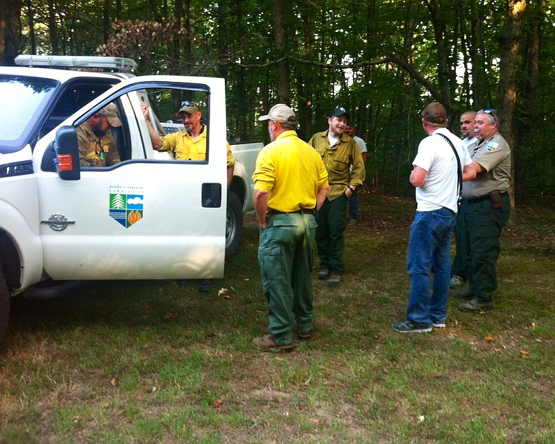 Georgia Forestry Commission and West Brow Fire And Rescue personal assemble below Covenant College on Lookout Mountain in before moving out to fight a wildfire on the west slope.