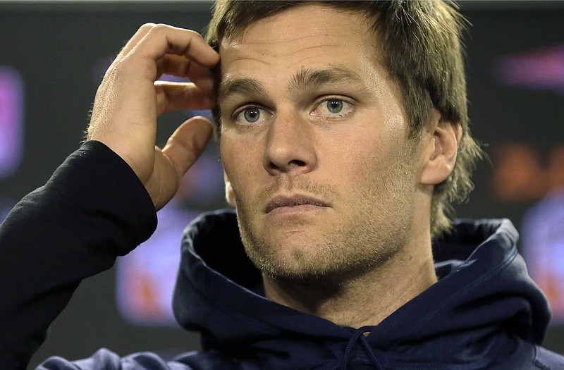 In this Jan. 6, 2016, file photo, New England Patriots quarterback Tom Brady faces reporters before a scheduled NFL football practice in Foxborough, Mass.