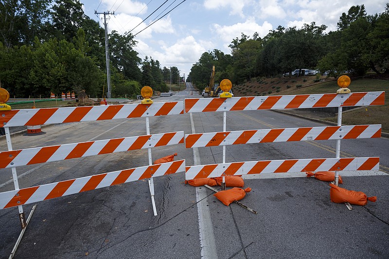 Barriers block Gunbarrel Road between Shallowford Road and Preston Circle on Friday, July 15, 2016, in Chattanooga, Tenn. The section of road is closed to traffic for a widening project.