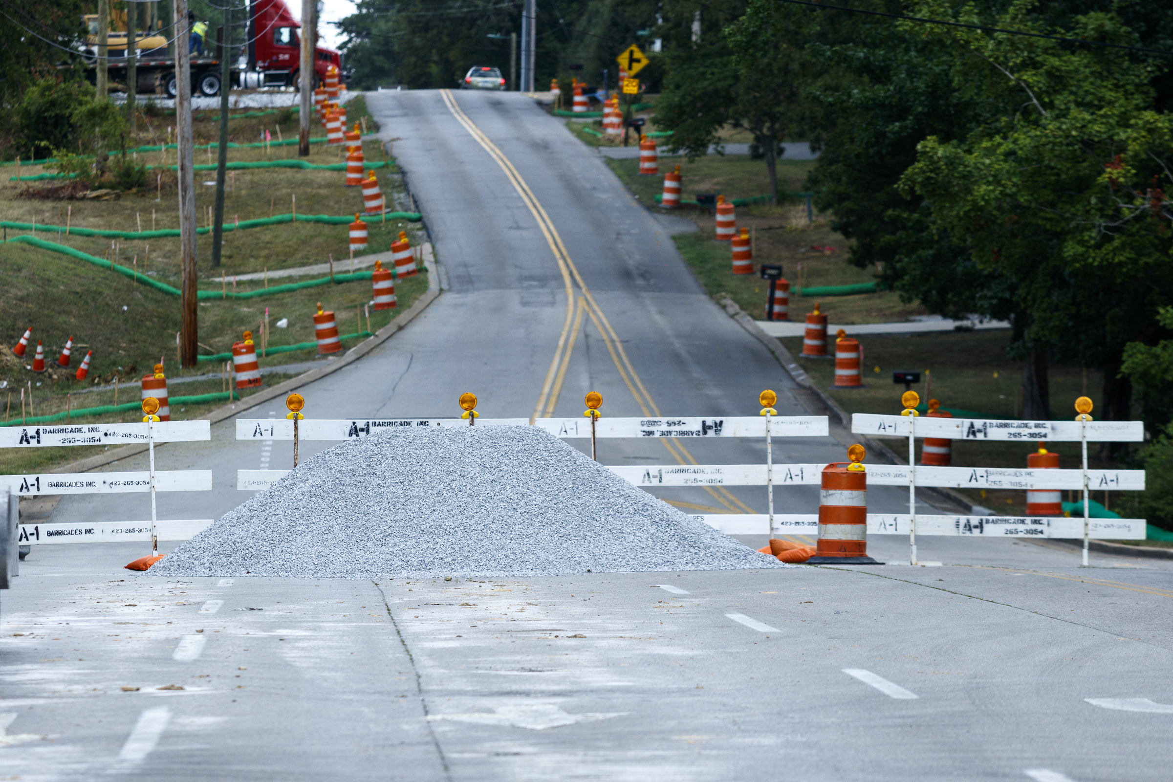 Barriers block access to Gunbarrel Road between Shallowford Road and Preston Circle on Friday, July 15, 2016, in Chattanooga, Tenn. The section of road is closed to traffic for a widening project.