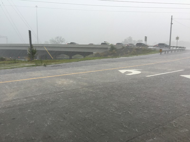 Rain pounds the road at Exit 20 on Interstate 75 around 2:30 p.m. Saturday.