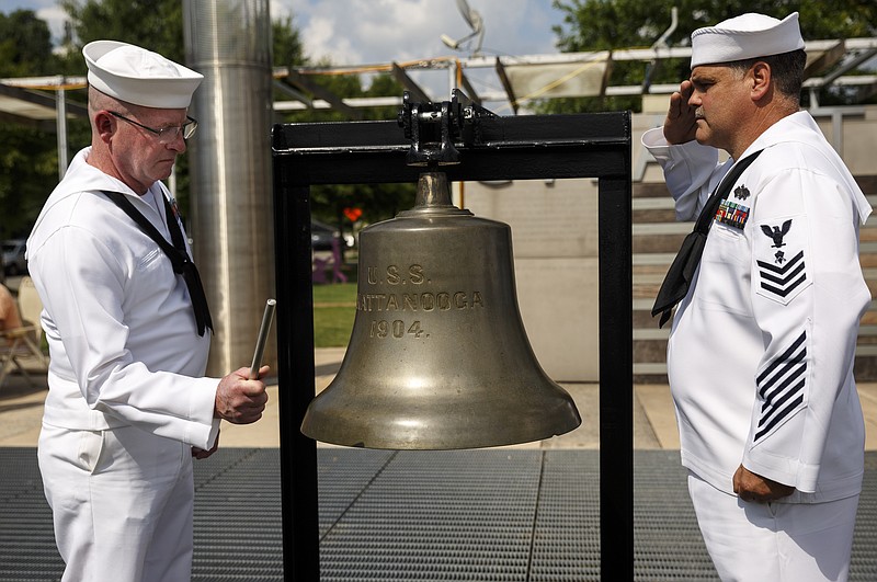 U.S. Navy Sailors ring the bell of the USS Chattanooga 5 times at a memorial service at Ross's Landing for the 5 servicemen killed in last July's attack on two area military facilities on Saturday, July 16, 2016, in Chattanooga, Tenn. Saturday marked one year since the attack by a lone gunman at a Lee Highway military recruiting center and the Naval Operational Support Center and Marine Corps Reserve Center off of Amnicola Highway.