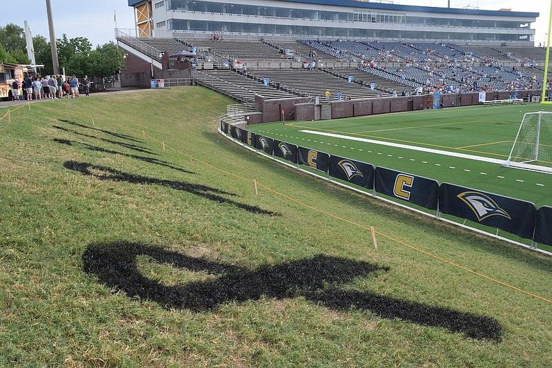 Five black ribbons mark the grass at Finley Stadium in memory of the five servicemen killed on July 16, 2015.  The Chattanooga Football Club faced the Houston Dutch Lions in playoff soccer at Finley Stadium Saturday July 16, 2016.