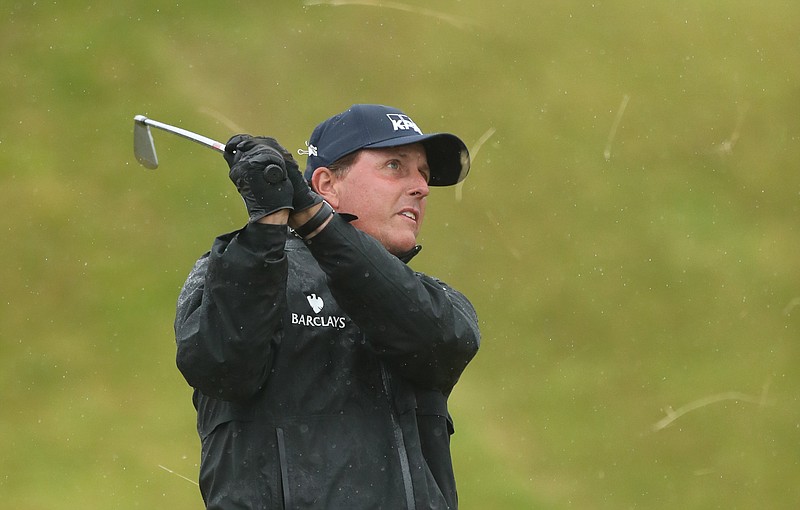 
              Phil Mickelson of the United States plays a shot on the 14th fairway during the second round of the British Open Golf Championships at the Royal Troon Golf Club in Troon, Scotland, Friday, July 15, 2016. (AP Photo/Peter Morrison)
            