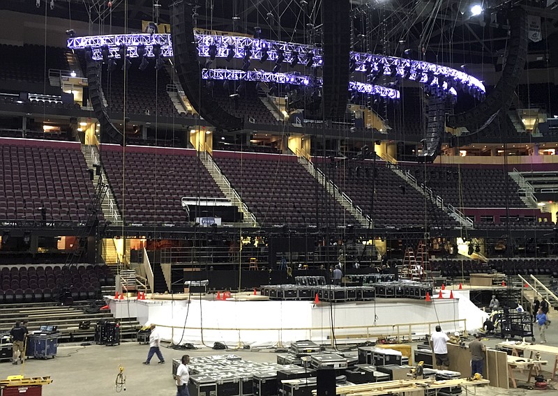 FILE - In this June 28, 2016 file photo, work continues on the main stage for the Republican National Convention in Cleveland. Donald Trump’s team promises an extraordinary display of political entertainment at the Republican National Convention, with the accent on entertainment.(AP Photo/Mark Gillispie, File)