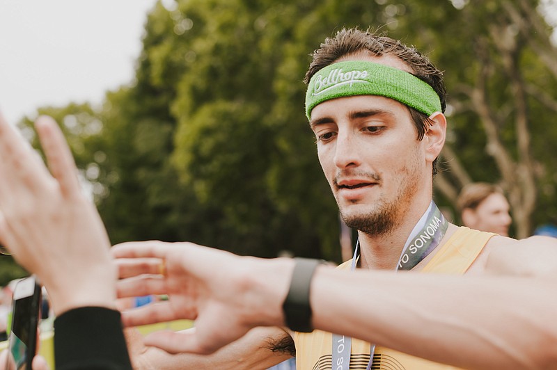 Nathan Sexton checks his race time after finishing the Napa to Sonoma Wine Country Half Marathon. / Contributed photo