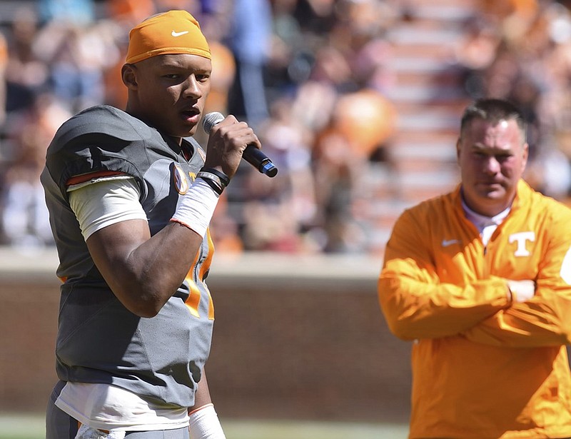 Tennessee quarterback Joshua Dobbs, left, and coach Butch Jones, right, know the Vols will need contributions from freshmen wide receivers this season to improve their offense.