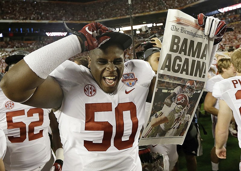 Alabama defensive lineman Alphonse Taylor celebrates after the Crimson Tide beat Notre Dame to win the national championship in Miami in January 2013. Taylor, a fifth-year senior entering the 2016 season, was arrested Sunday morning and charged with driving under the influence.