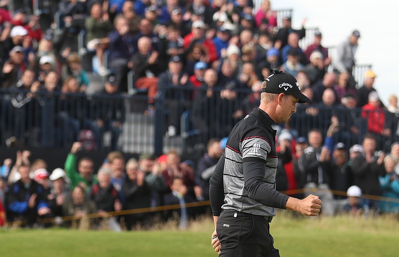 
              Henrik Stenson of Sweden celebrates after getting a birdie on the 14th green during the final round of the British Open Golf Championship at the Royal Troon Golf Club in Troon, Scotland, Sunday, July 17, 2016. (AP Photo/Peter Morrison)
            