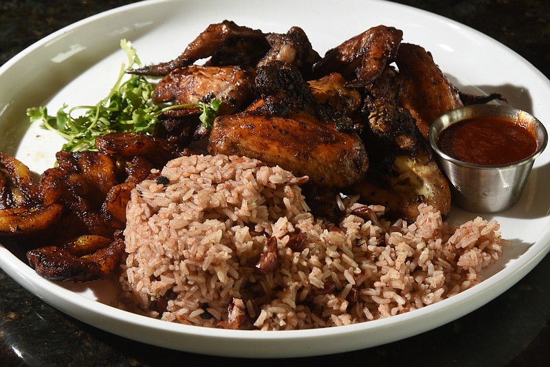 Jan Goldsmith prepared Jamaican jerk chicken wings, plantains and rice Sunday, July 17, 2016.