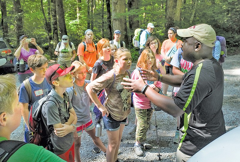 Park Superintendent Cassius Cash preps a group of Junior Naturalists for a hike on the Porters Creek Trail on Thursday in the Greenbriar section of the Great Smoky Mountains National Park.