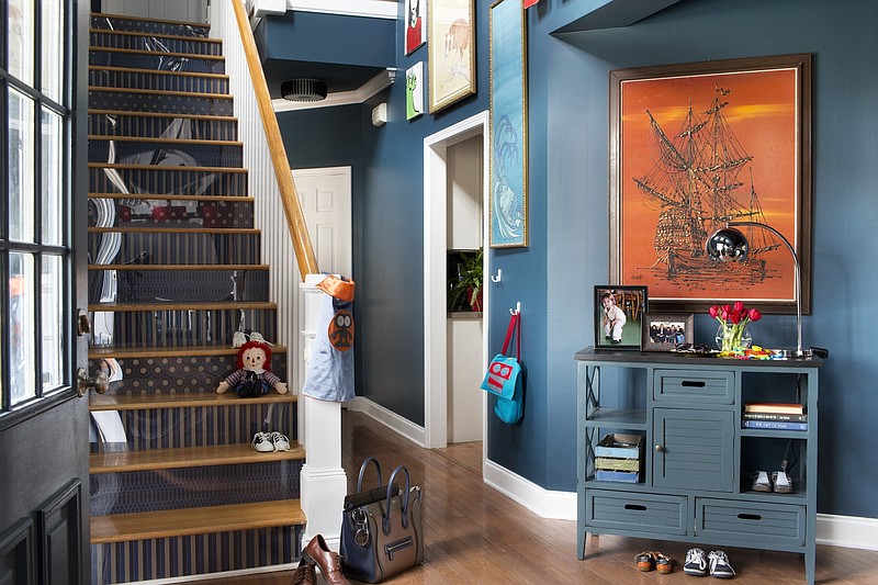 In this entryway, the stair risers are wallpapered in contrasting patterns, bringing a dose of style and personality to a space that is often overlooked in many homes.