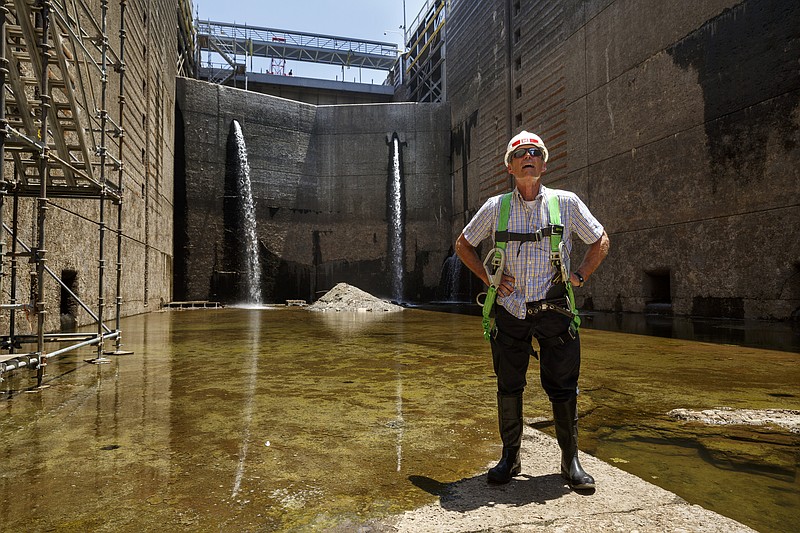 Tom Hale, Army Corps of Engineers operations manager for the Tennessee River navigation area, stands inside the dewatered Chickamauga Lock at the Chickamauga Dam on Wednesday, July 20, 2016, in Chattanooga, Tenn. The lock is being dewatered for routine maintenance checks.