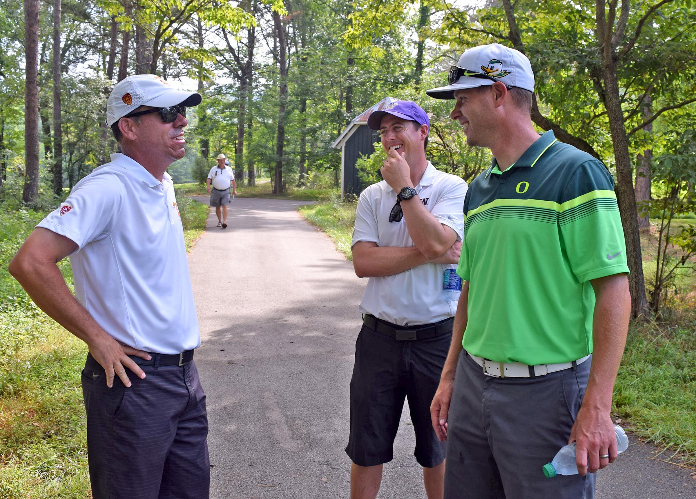 From left, Chris Zambri, head golf coach of the University of Southern California, talks to Washington University assistant Van Williams, and University of Oregon assistant Michael Wilson. The third day of the 69th U.S. Junior Amateur Championship was held at the Honors Course in Ooltewah, Tennessee, Wednesday July 20, 2016.