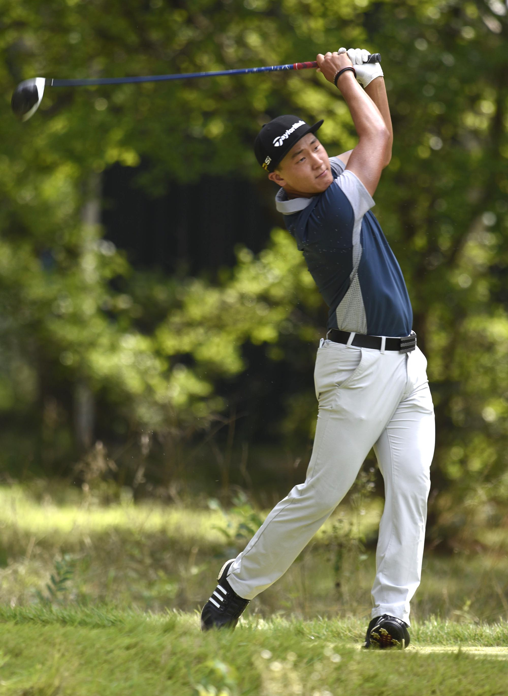 John Pak of Scotch Plains, New Jersey watches his drive on the 6th hole. The third day of the 69th U.S. Junior Amateur Championship was held at the Honors Course in Ooltewah, Tennessee, Wednesday July 20, 2016.