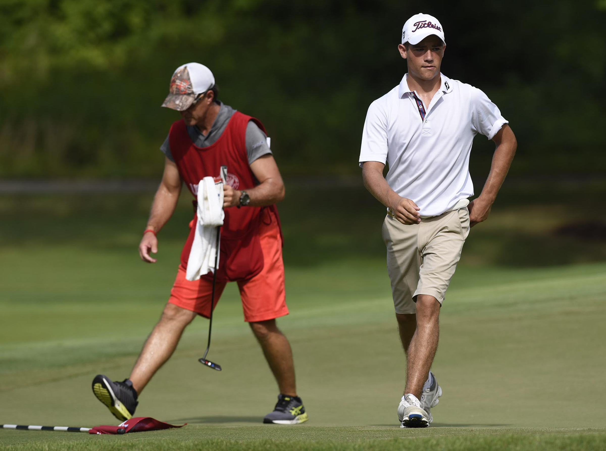 Noah Goodwin of Corinth, Texas strides off the green after winning a hole against Runchanapong Youprayong of Thailand. Goodwin went on to win the match 6 and 5. The third day of the 69th U.S. Junior Amateur Championship was held at the Honors Course in Ooltewah, Tennessee, Wednesday July 20, 2016.