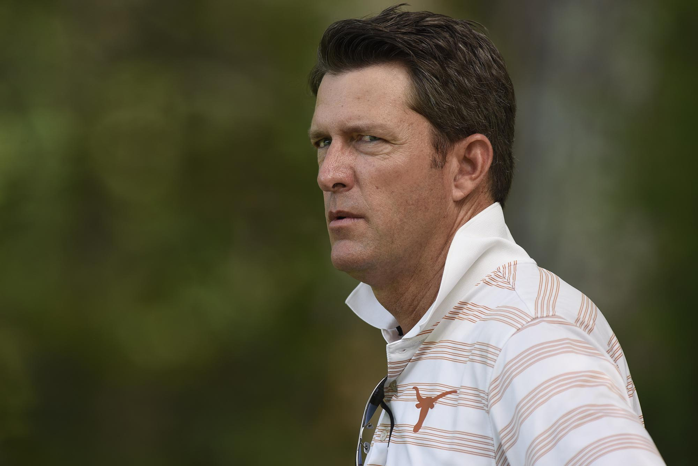 University of Texas assistant golf coach Jean-Paul Hebert watches play on the 5th hole. The third day of the 69th U.S. Junior Amateur Championship was held at the Honors Course in Ooltewah, Tennessee, Wednesday July 20, 2016.