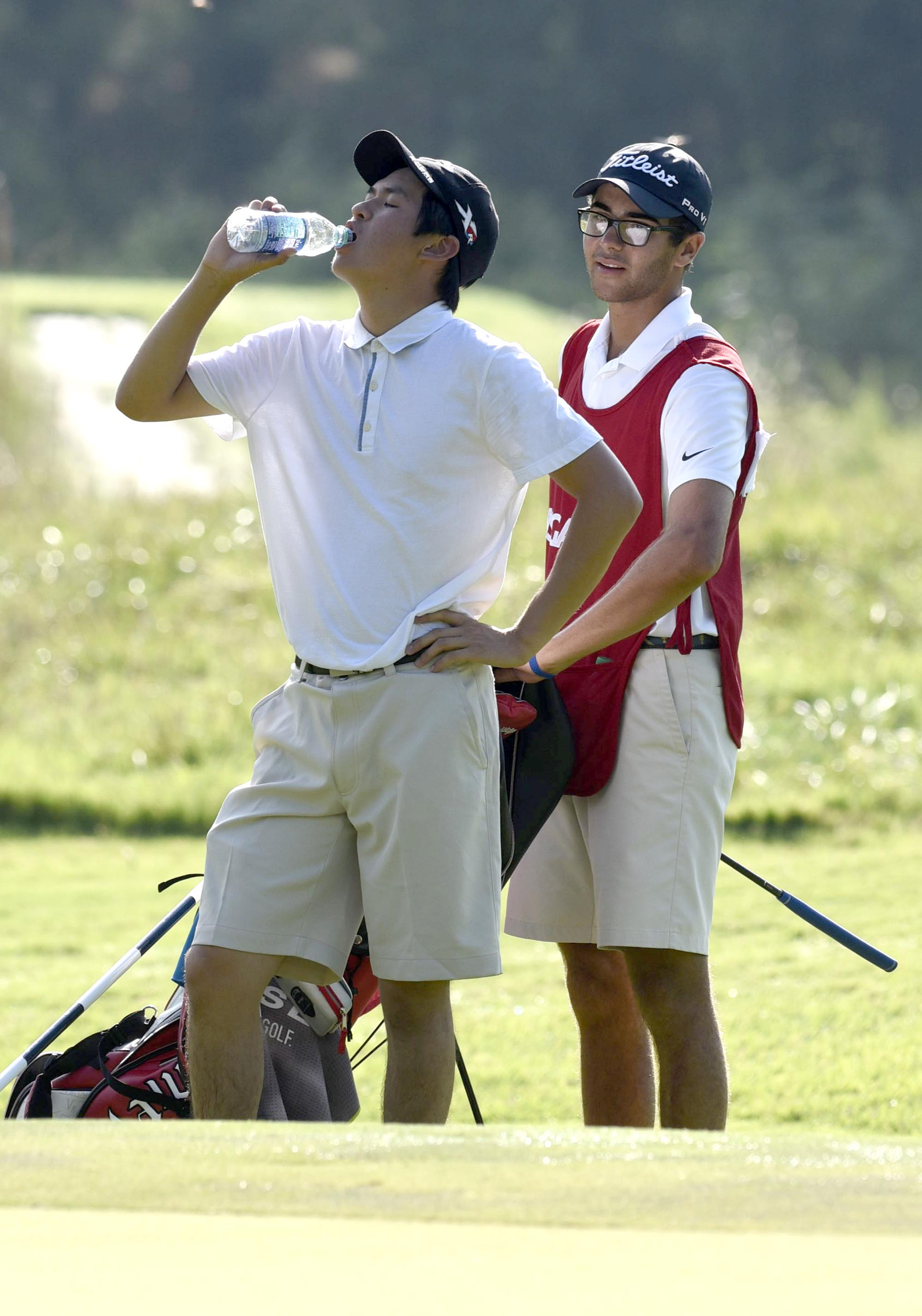 Fred Lee of Australia drinks water along the 4th as the humidty and heat climb. The third day of the 69th U.S. Junior Amateur Championship was held at the Honors Course in Ooltewah, Tennessee, Wednesday July 20, 2016.