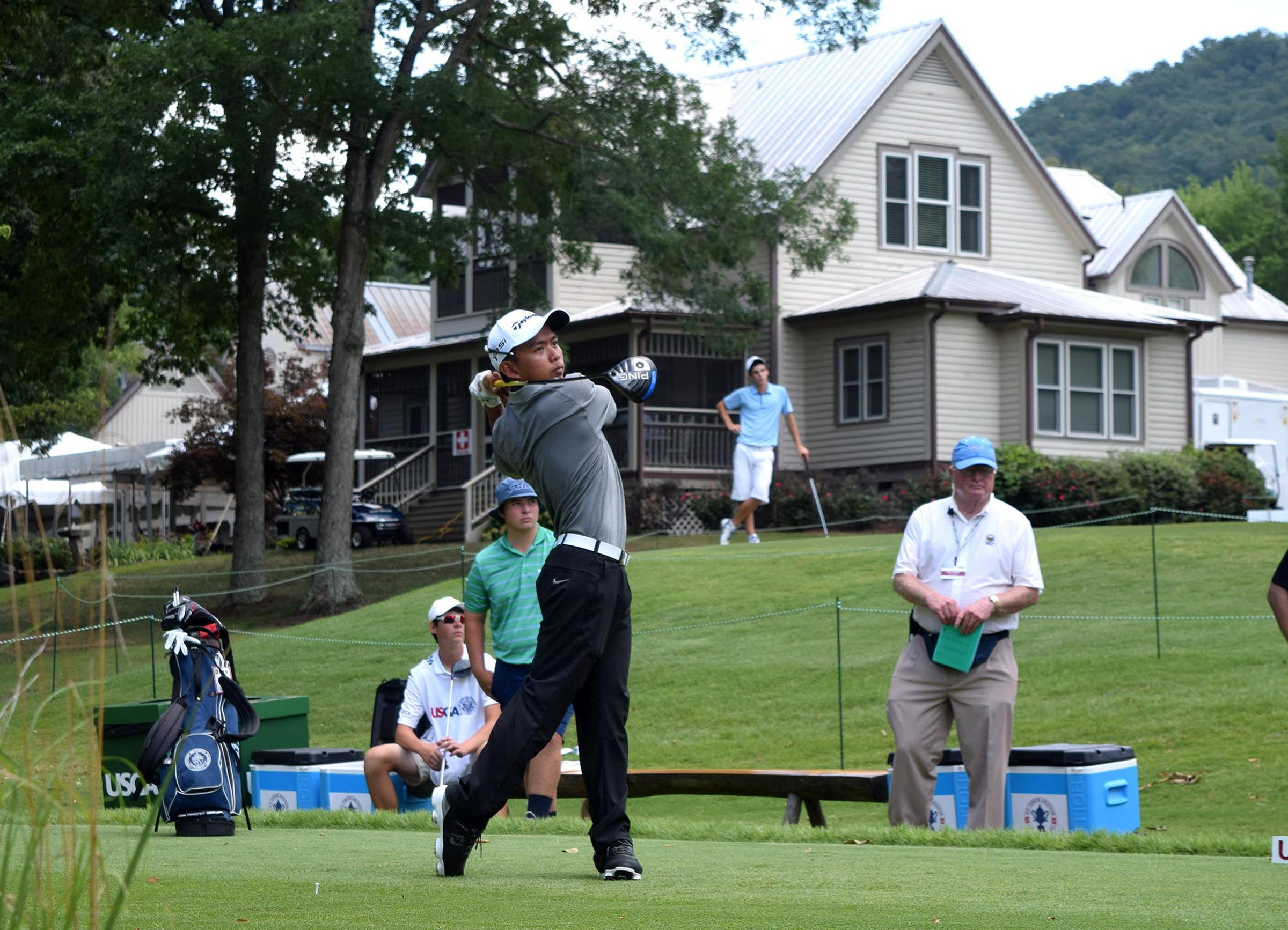 Wei Wei Gao of the Phillippines watches his drive on the 10th hole. The Honors clubhouse is seen in the background. The third day of the 69th U.S. Junior Amateur Championship was held at the Honors Course in Ooltewah, Tennessee, Wednesday July 20, 2016.