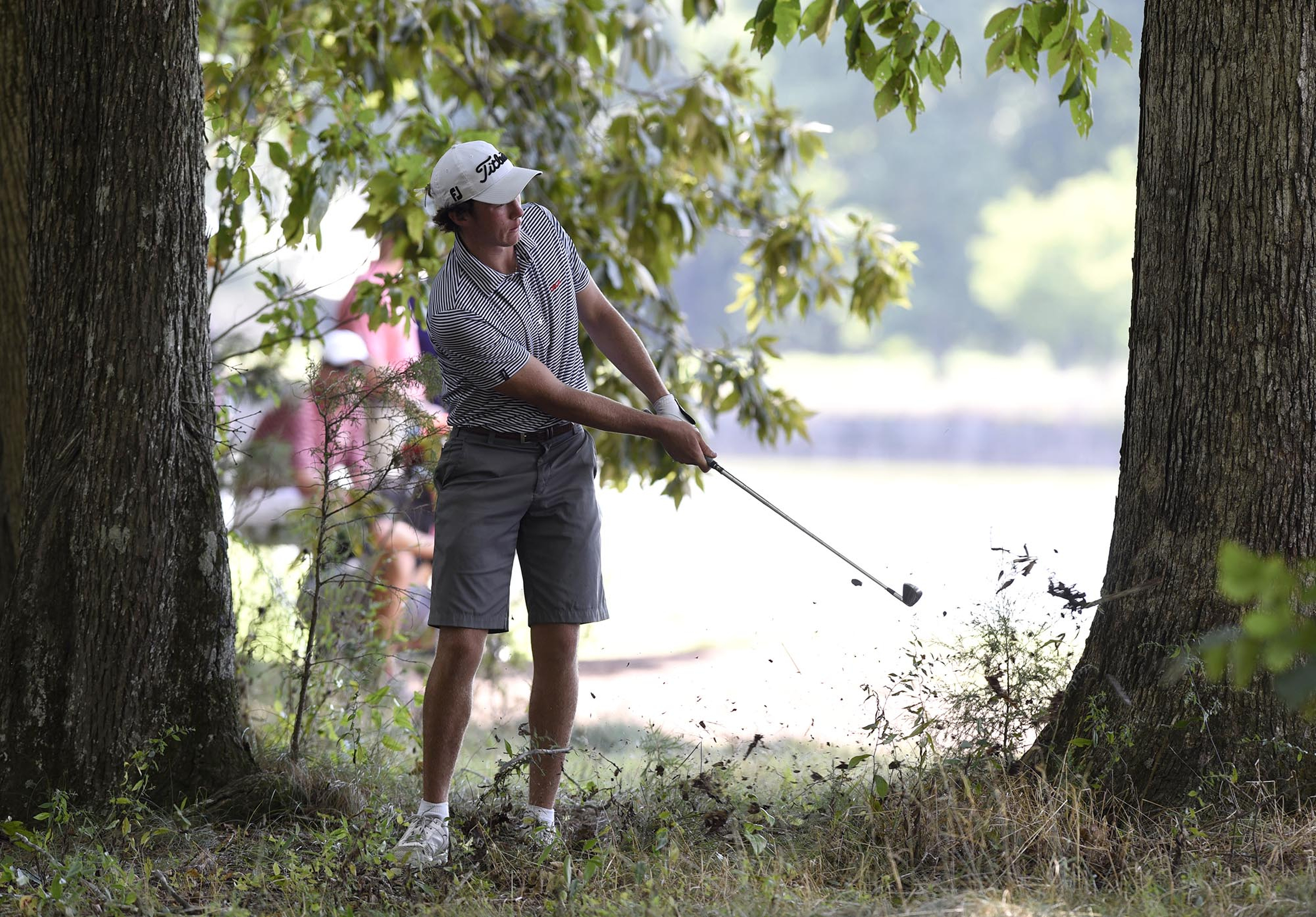 Chris Nido, Palmetto Bay, Florida hits from the rough on the 15th hole. Nido was defeated by Australia's Min Woo Lee 2 and 1. The third day of the 69th U.S. Junior Amateur Championship was held at the Honors Course in Ooltewah, Tennessee, Wednesday July 20, 2016.