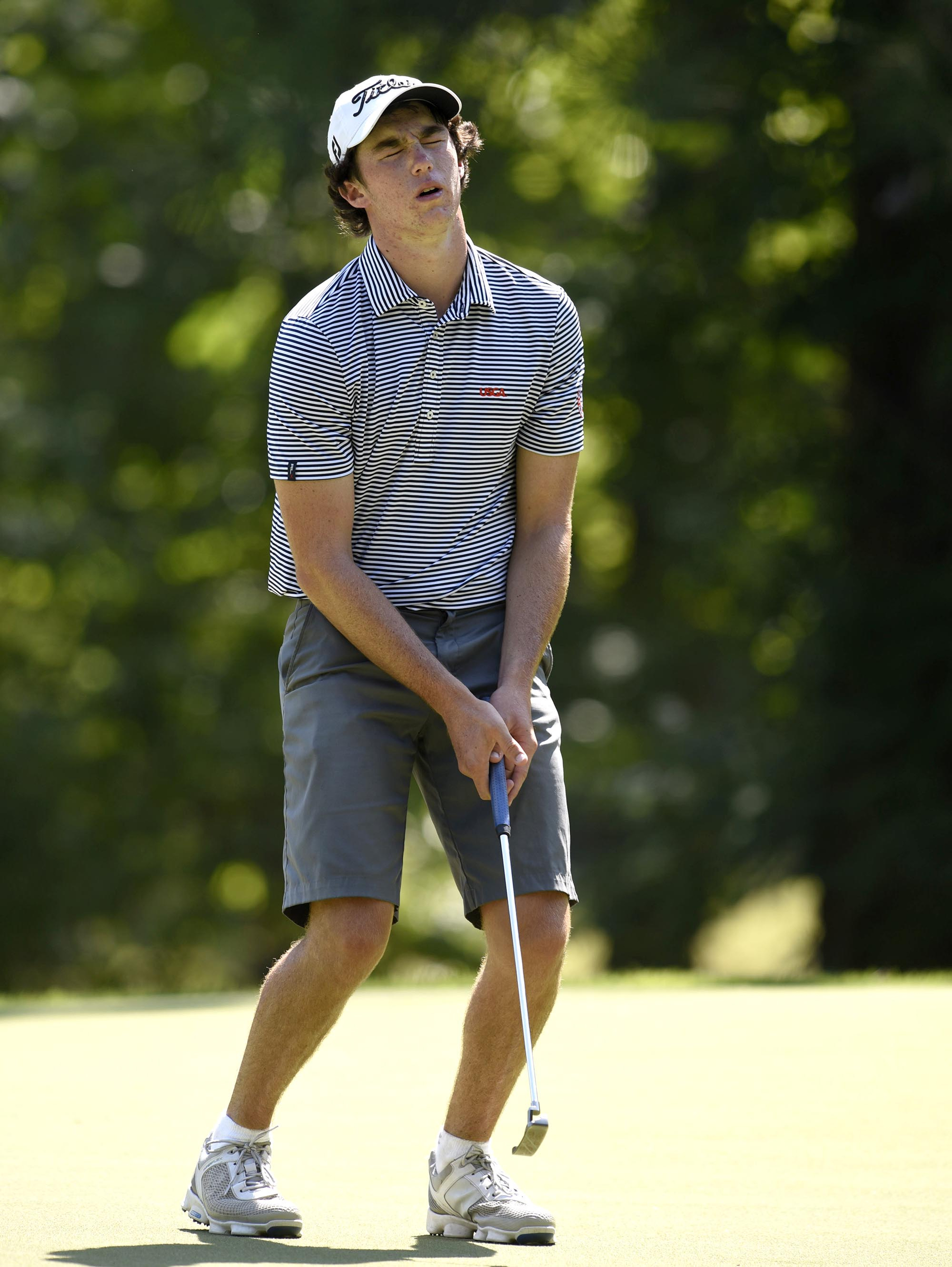 Chris Nito of Palmetto Bay, Florida reacts to missing a putt on the 17th hole that would have extended his match with Australia's Min Woo Lee. Lee won 2 and 1. The third day of the 69th U.S. Junior Amateur Championship was held at the Honors Course in Ooltewah, Tennessee, Wednesday July 20, 2016.