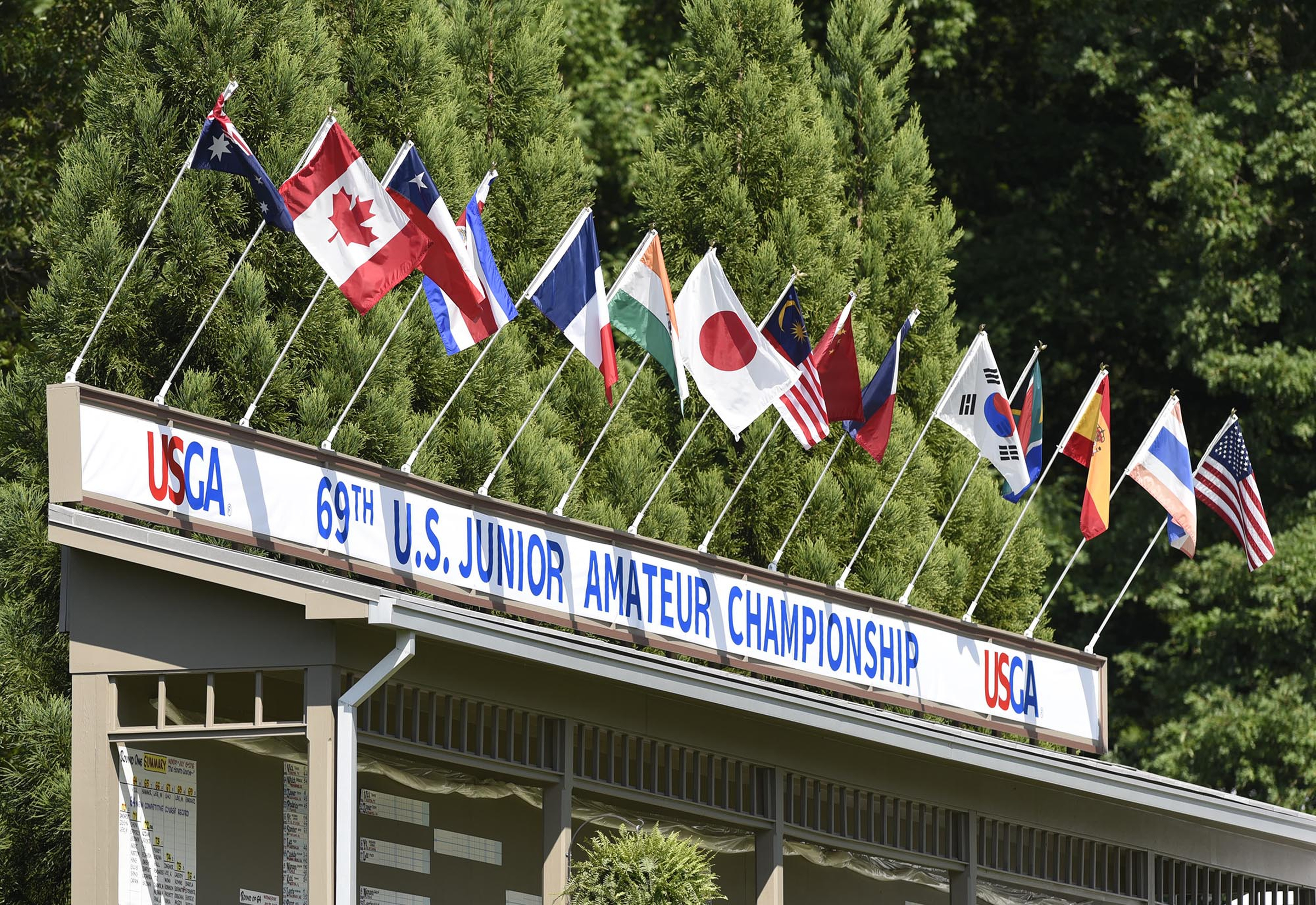 The flags of the partcipating countries fly from the scoreboard. The third day of the 69th U.S. Junior Amateur Championship was held at the Honors Course in Ooltewah, Tennessee, Wednesday July 20, 2016.