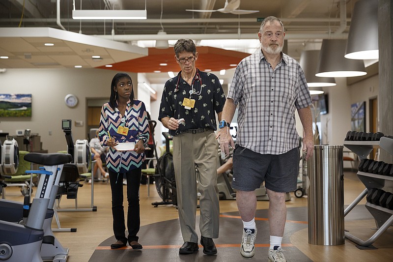 Intern Makalah Smith, left, takes notes for cardiac rehab manager Allan Lewis, center, as he puts patient Richard Sullivan through a 6-minute walk test in CHI Memorial Hospital's cardiac rehabilitation facility on Thursday, July 14, 2016, in Chattanooga, Tenn. More than 40 businesses and organizations in Hamilton County have offered paid internships to high school students through the Step-Up Chattanooga program.
