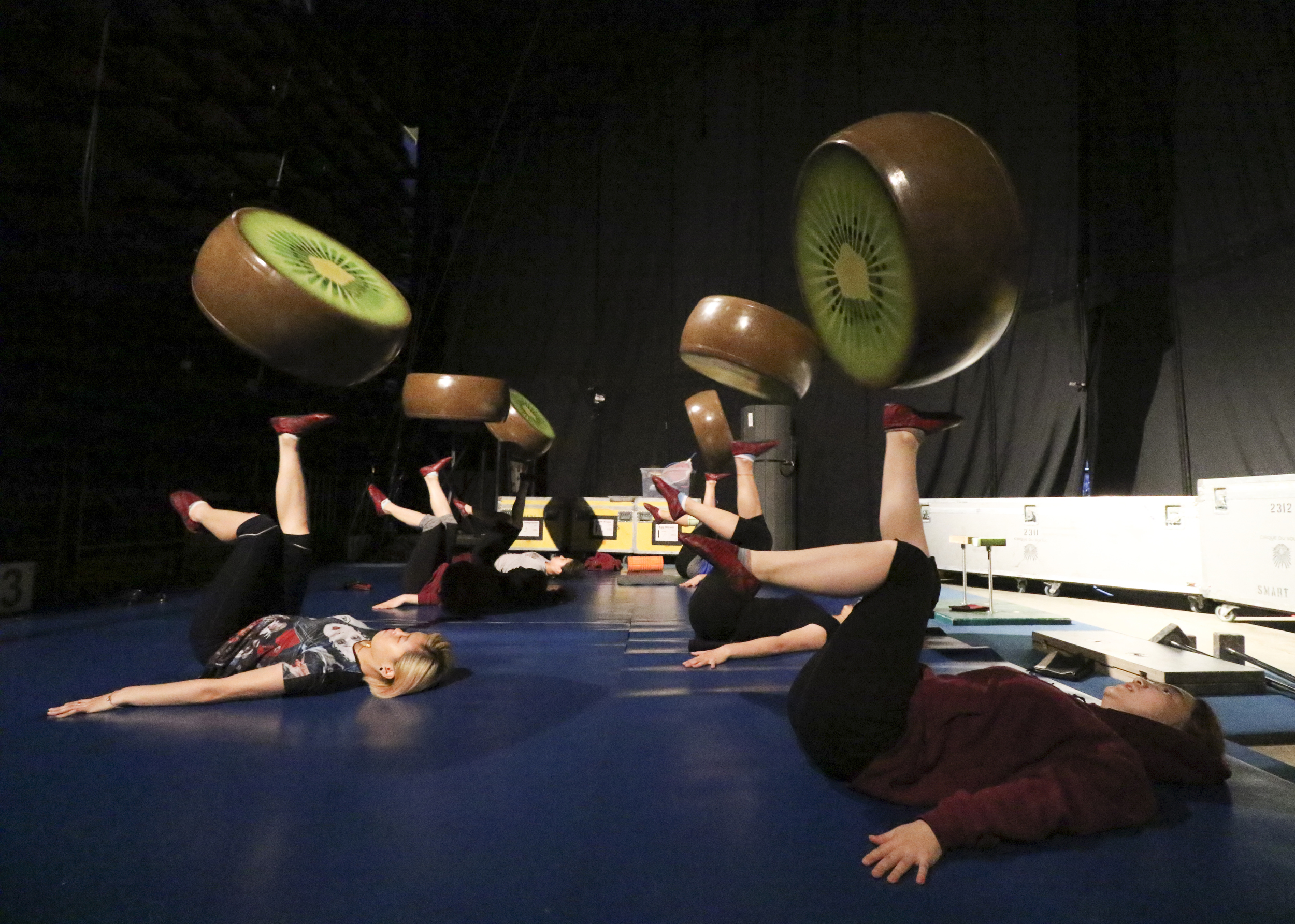 Staff Photo by Dan Henry / The Chattanooga Times Free Press- 7/20/16. Foot jugglers who will be dressed as ants warm up before the opening night of the OVO Cirque Du Soleil being held at McKenzie arena in Chattanooga, Tenn., July 20-24 2016. The OVO Cirque show features performers as insects in colorful costumes performing acts including foot juggling, hand balancing, rock climbing, acrobatics and slack lining.