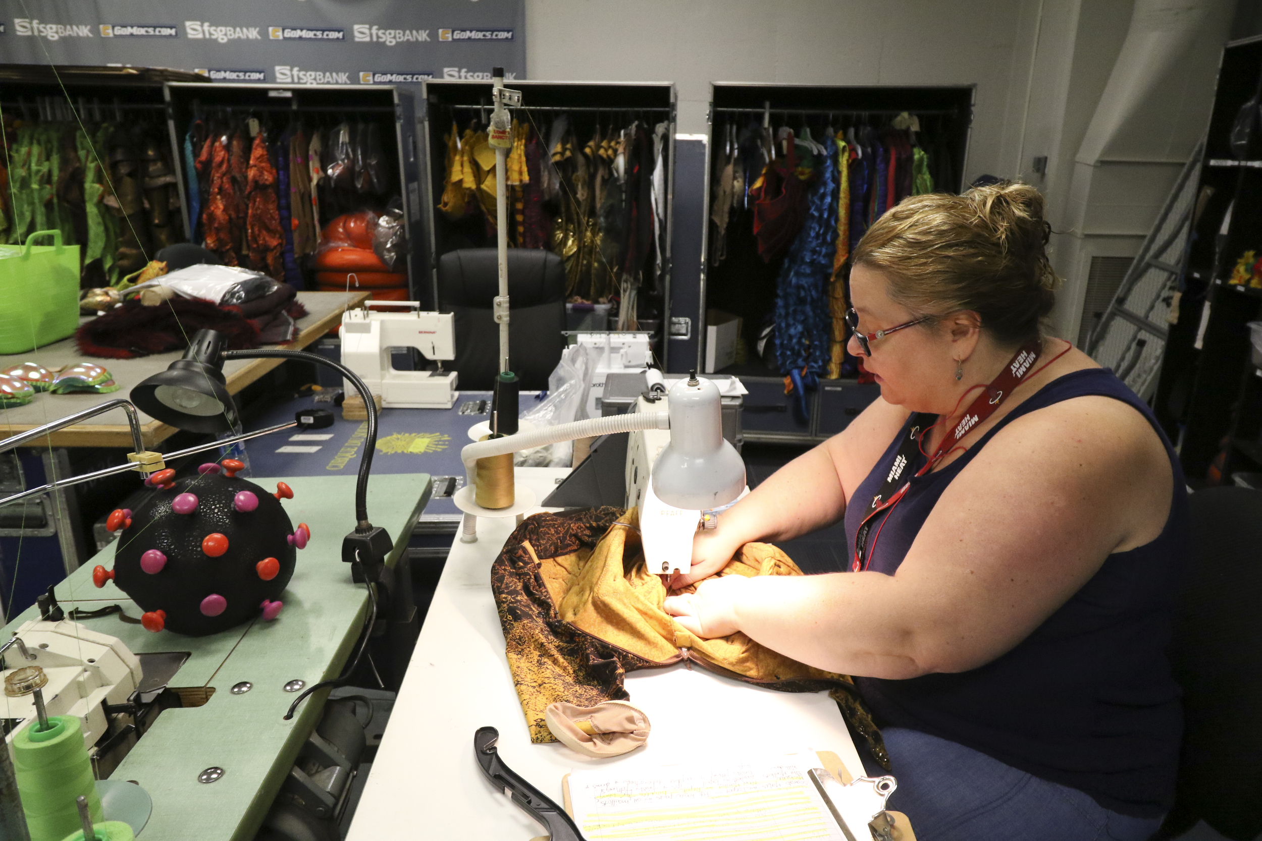 Staff Photo by Dan Henry / The Chattanooga Times Free Press- 7/20/16. Julie O'Brien, a wardrobe assistant, makes repairs to costumes before the opening night of the OVO Cirque Du Soleil being held at McKenzie arena in Chattanooga, Tenn., July 20-24 2016. The OVO Cirque show features performers as insects in colorful costumes performing acts including foot juggling, hand balancing, rock climbing, acrobatics and slack lining.