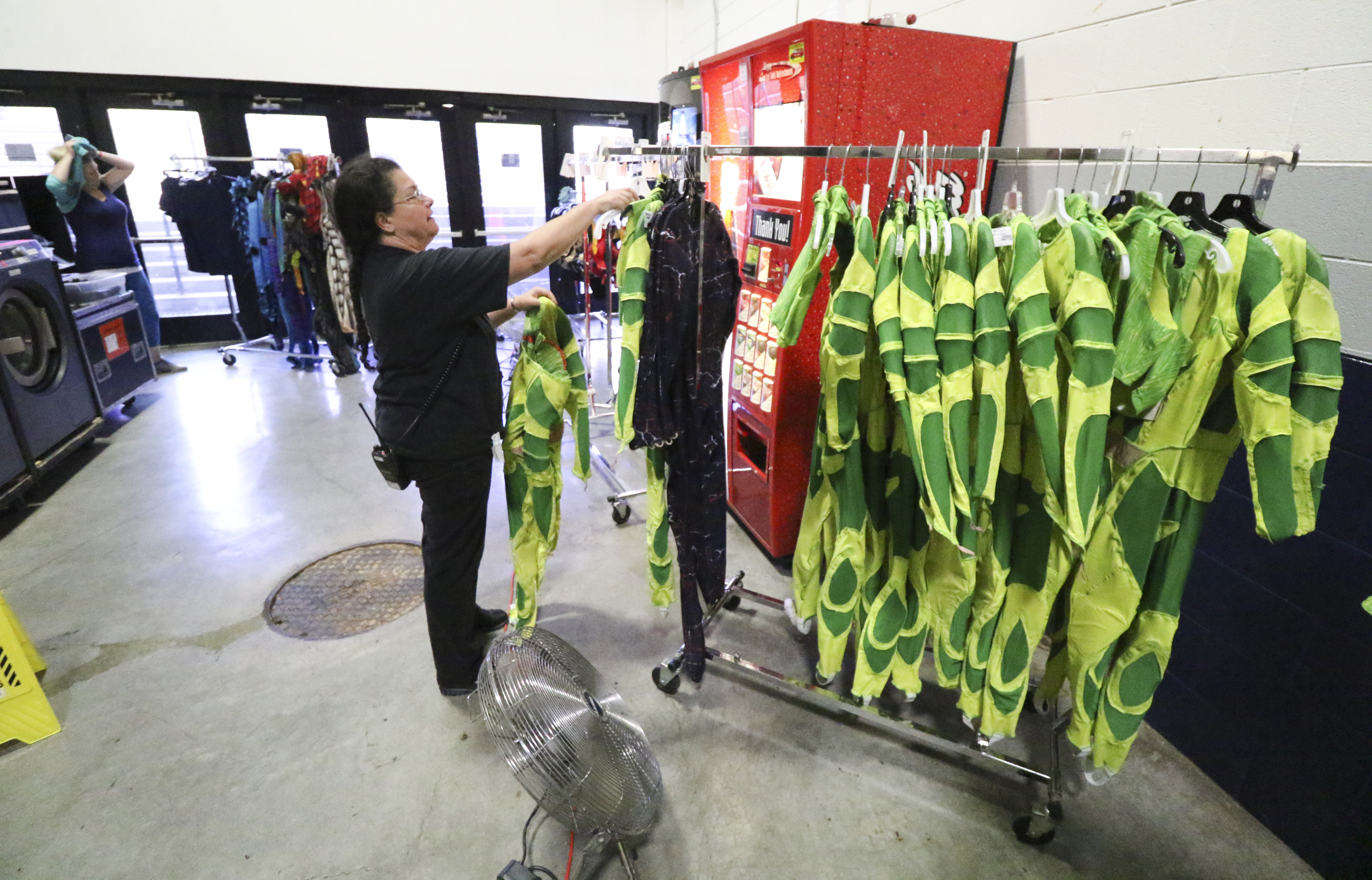 Staff Photo by Dan Henry / The Chattanooga Times Free Press- 7/20/16. Amy Brown checks costumes before the opening night of the OVO Cirque Du Soleil being held at McKenzie arena in Chattanooga, Tenn., July 20-24 2016. The OVO Cirque show features performers as insects in colorful costumes performing acts including foot juggling, hand balancing, rock climbing, acrobatics and slack lining.