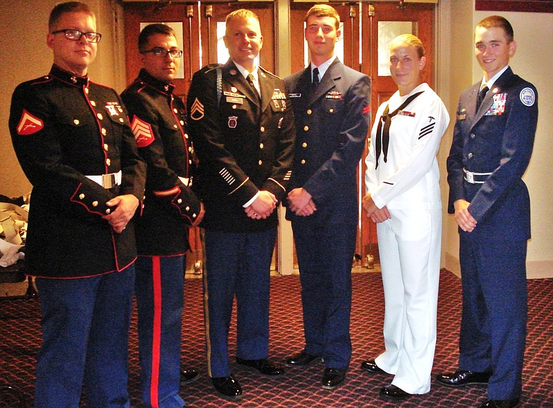 Members of a Joint Armed Forces color guard included, from left, Lance Cpl. John Chappell and Sgt. Donovan Walters, both U.S. Marine Corps; Staff Sgt. David Ward, Army; Seaman Cameron Brown, Coast Guard; Hospitalman Seaman Terra Walker, Navy; and Cadet Col. Ethan Seitz, Hixson High School ROTC.