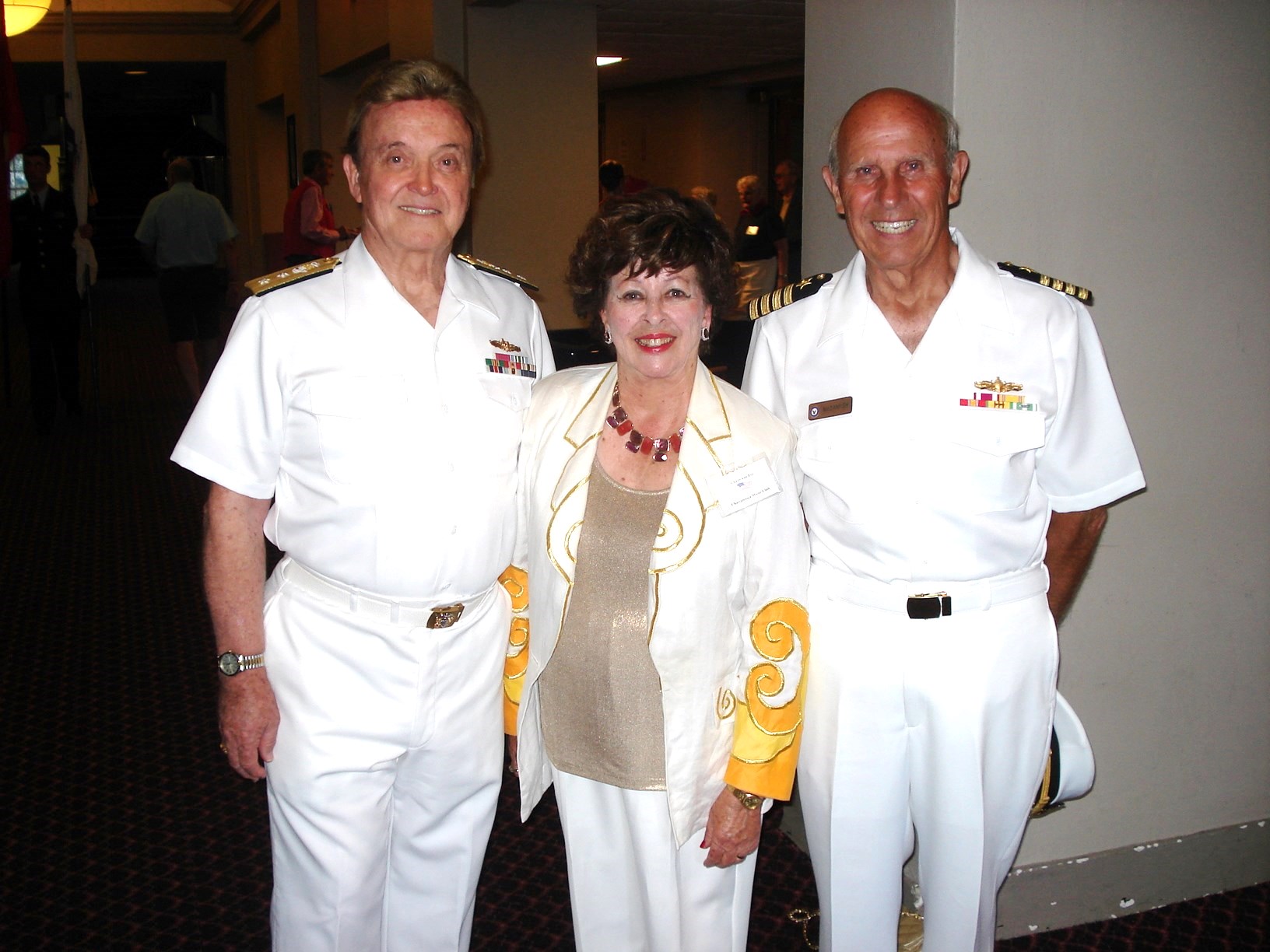 Retired Adm. Vance Fry, Charlynne Fry and Capt. Mickey McCamish, from left.