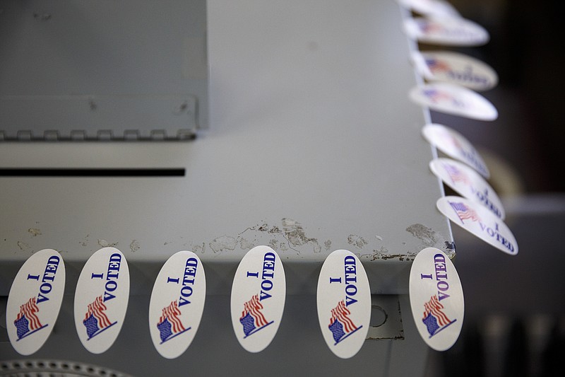 "I Voted" stickers, awaiting early voters, adorn a ballot stub box during early voting at the Hamilton County Election Commission.