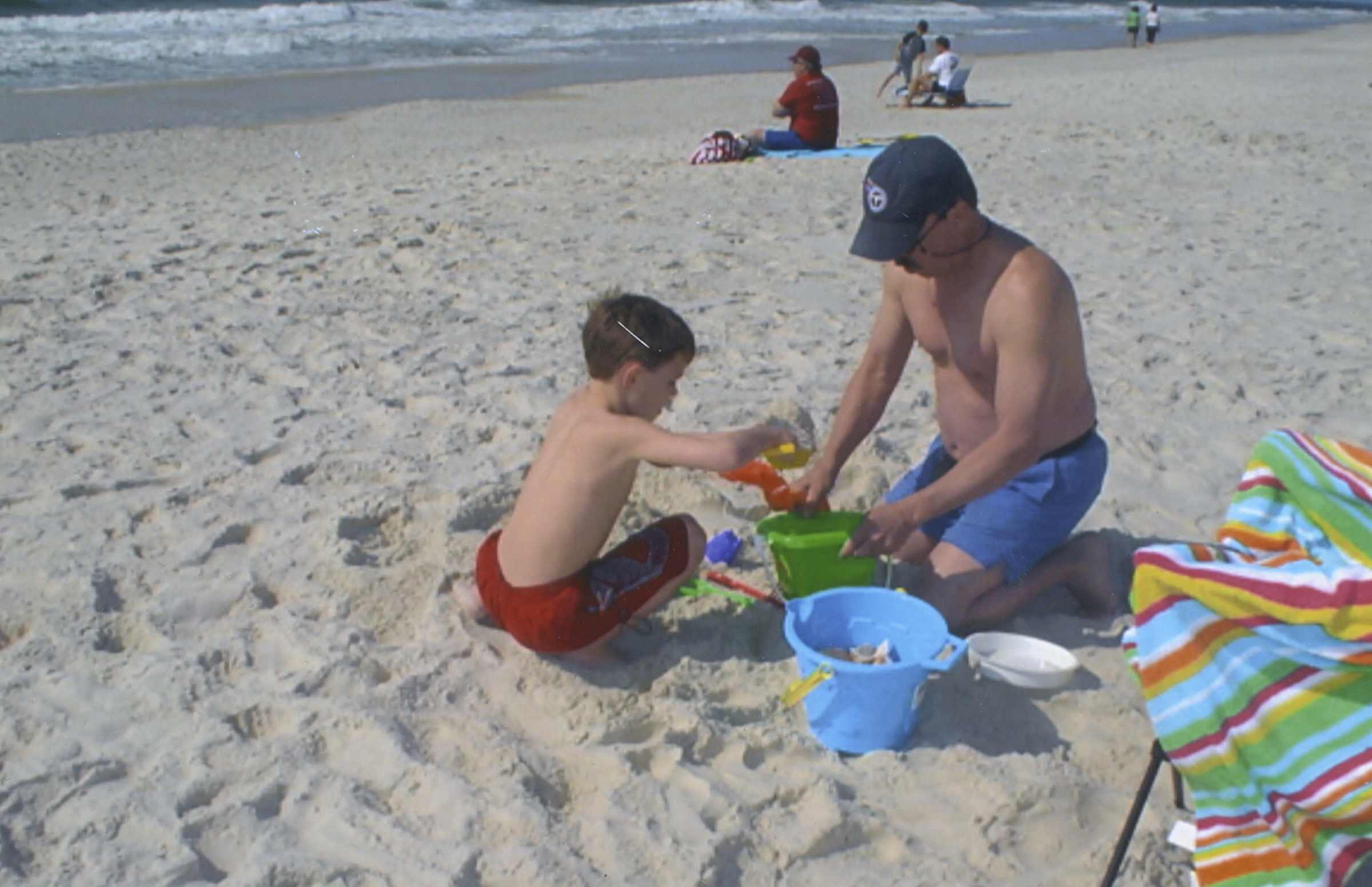 Randy Roberts plays with his son, Matthew, on a trip to Gulf Shores in 2009.