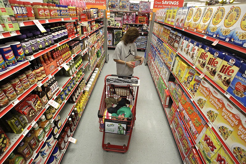 Take cereal, for example. Research published in the Journal of Environment and Behavior found that kids’ cereals tended to be placed on lower shelves where they are more eye-level with children. It’s just one example of the tactics food companies and supermarkets use to sway what people put in their carts. (AP Photo/Tony Gutierrez, File)