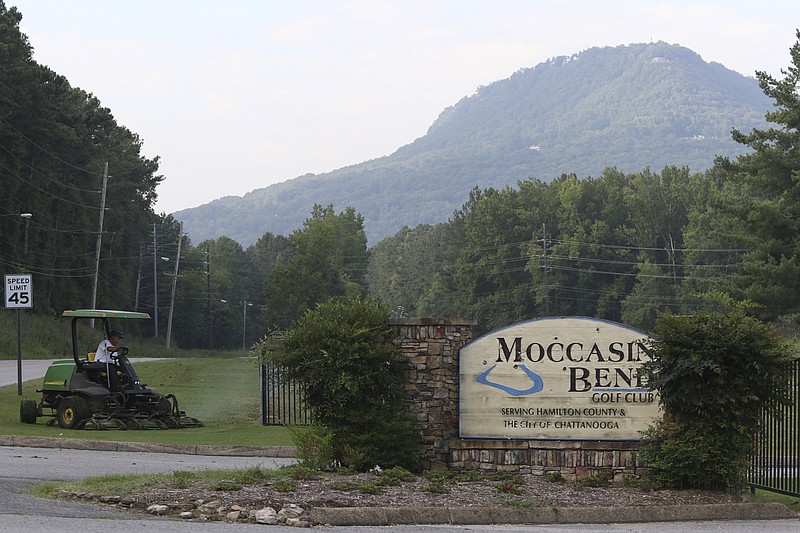 Staff Photo by Dan Henry / The Chattanooga Times Free Press- 7/21/16. Eddie Thomas mows the lawn in front of the Moccasin Bend Golf Course on Thursday, July 21, 2016. The grounds crew at Moccasin Bend have been looking to avoid the heat by knocking out their work earlier in the day. 