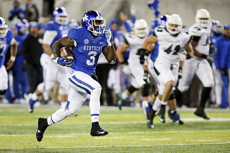 Kentucky running back Jojo Kemp breaks free for a touchdown run in last season's 58-10 thrashing of Charlotte.