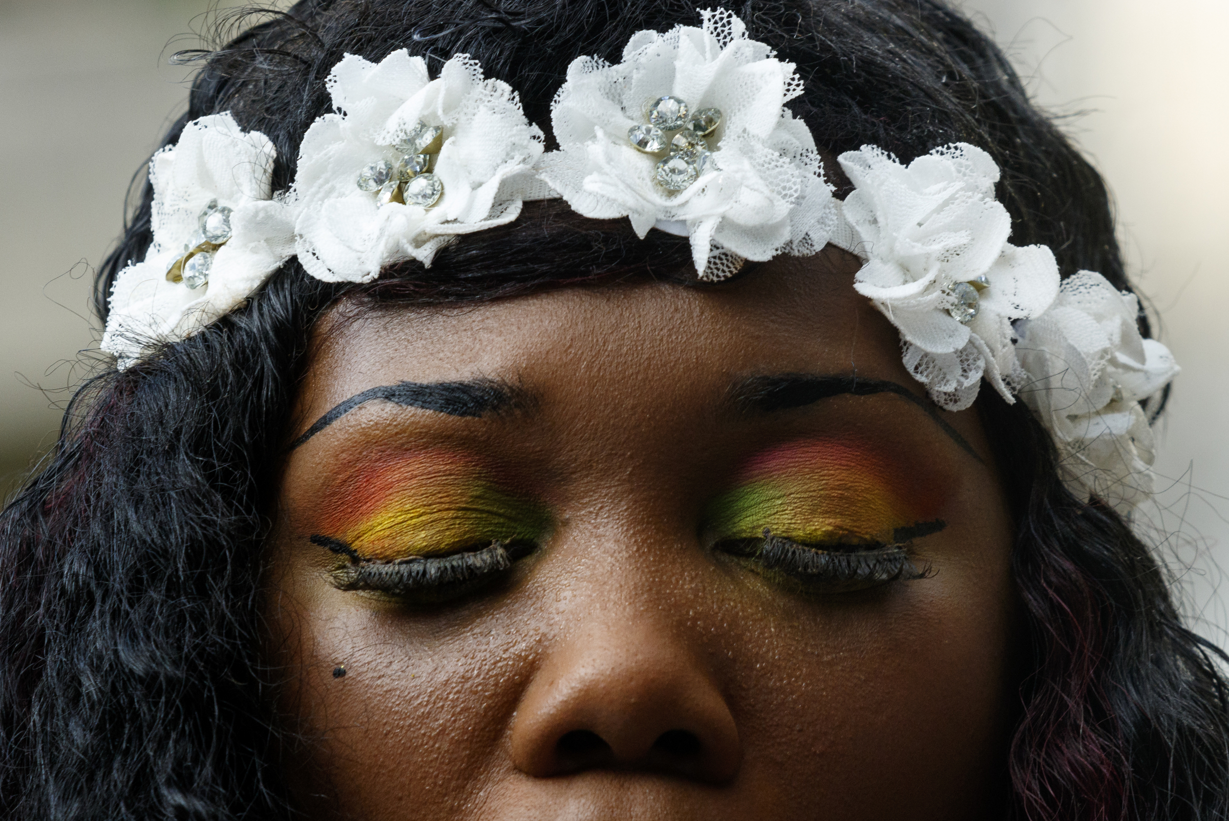 Pastor Charlotte Williams wears rainbow eyeshadow as she speaks during a Black Lives Matter protest in Miller Park on Thursday, July 21, 2016, in Chattanooga, Tenn. Protesters marched from Miller Park to the Tennessee Aquarium and back, stopping and blocking numerous intersections along the route.