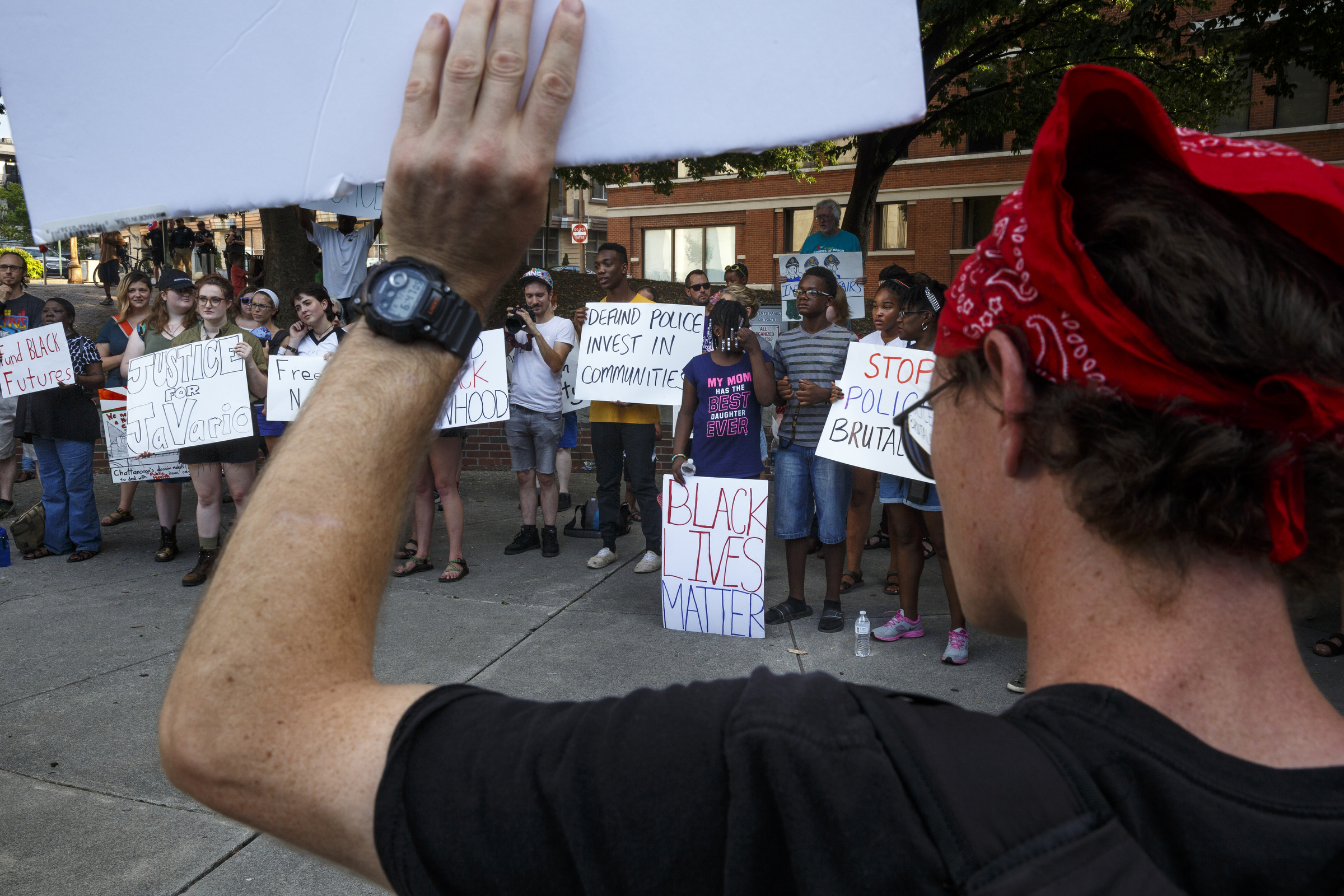 Protesters gather in Miller Park for a Black Lives Matter protest Thursday, July 21, 2016, in Chattanooga, Tenn. Protesters marched from Miller Park to the Tennessee Aquarium and back, stopping and blocking numerous intersections along the route.