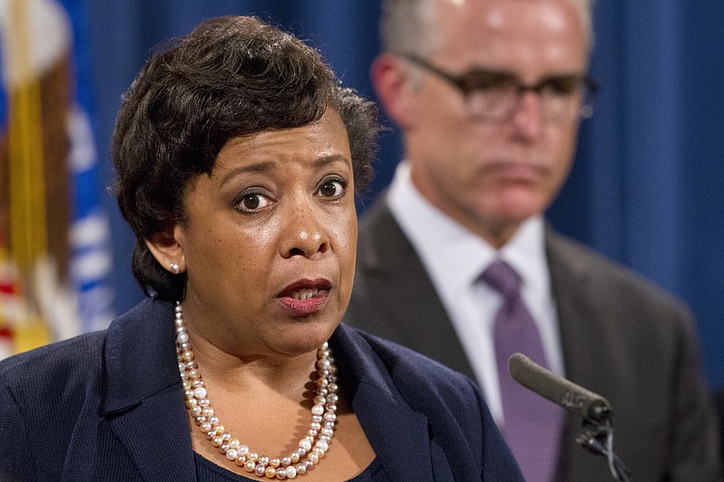 
              Attorney General Loretta Lynch, left, with FBI Deputy Director Andrew McCabe, speaks during a news conference, Wednesday, July 20, 2016, at the Justice Department in Washington, announcing that the U.S. government is seeking the forfeiture of more than $1 billion in assets that federal officials say were misappropriated from a Malaysian sovereign wealth fund.  (AP Photo/Jacquelyn Martin)
            