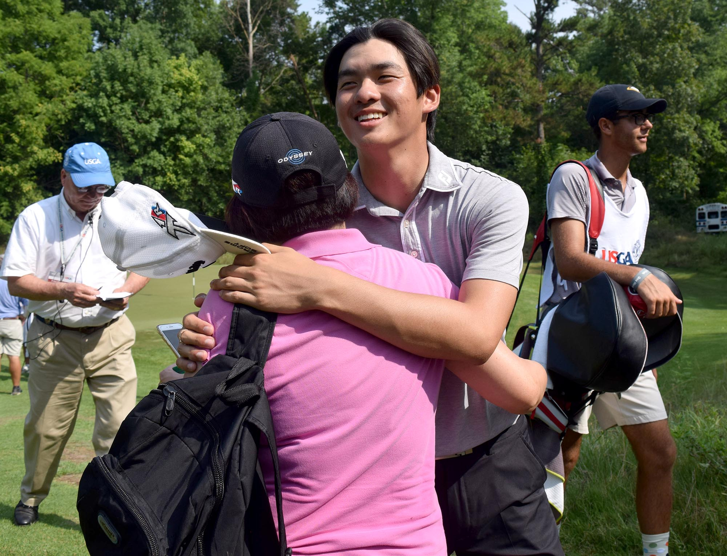 Fred Lee of Australia hugs his mother, Jenny, after losing his quarterfinal match to Noah Goodwin of Corinth, Texas.  The fifth day of the 69th U.S. Junior Amateur Championship was held at the Honors Course in Ooltewah, Tennessee, Friday July 22, 2016.