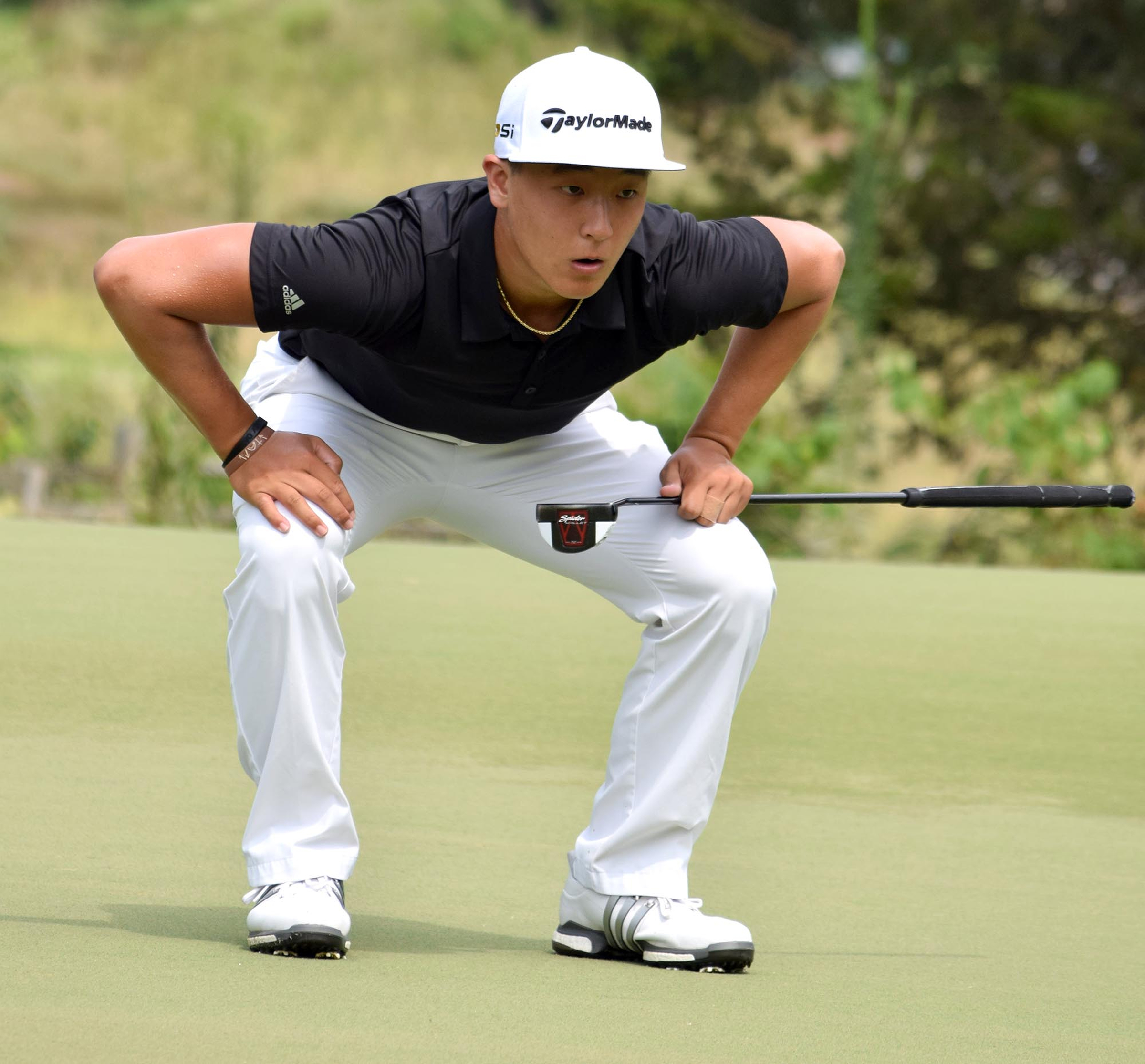 John Pak of Scotch Plains, New Jersey reacts as he misses a putt on the 18th hole in his quarterfinal match with Won Jun Lee of the Republic of Korea.  Pak won 1 up.  The fifth day of the 69th U.S. Junior Amateur Championship was held at the Honors Course in Ooltewah, Tennessee, Friday July 22, 2016.