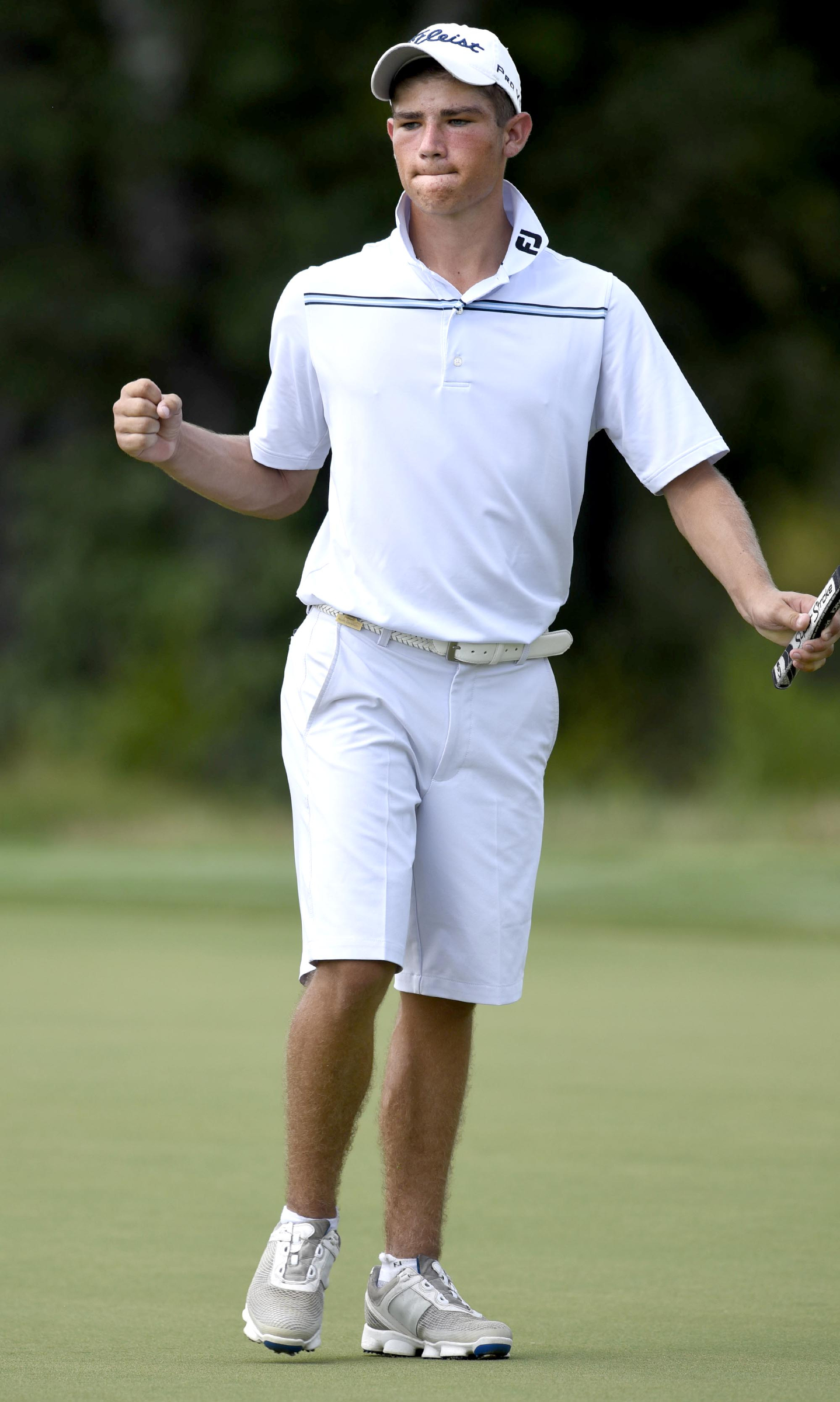 Noah Goodwin pumps his fist after making a long put that would win him the hole on the 15th green.  Goodwin won his semifinal match over John Pak of Scotch Plains, New Jersey after 20 holes. The fifth day of the 69th U.S. Junior Amateur Championship was held at the Honors Course in Ooltewah, Tennessee, Friday July 22, 2016.