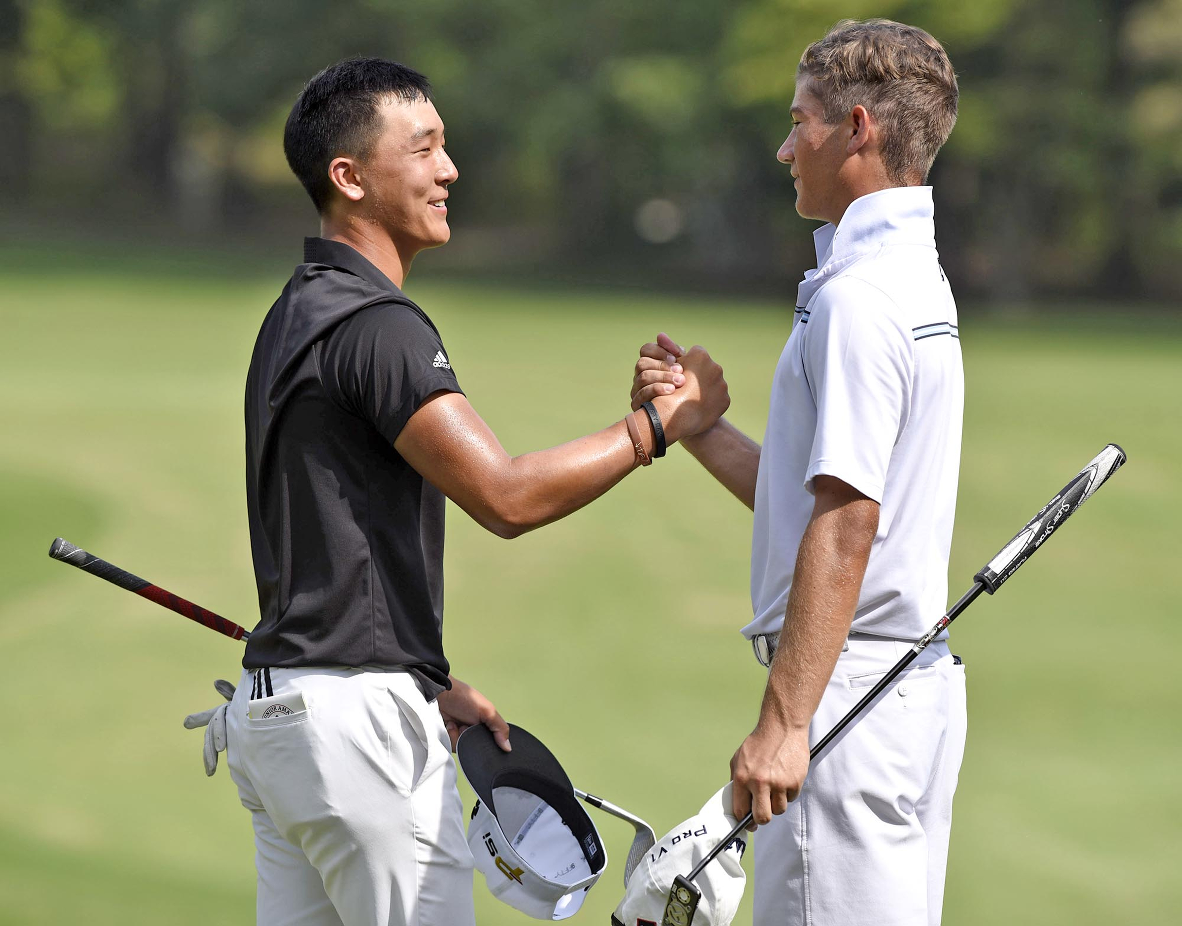 John Pak of Scotch Plains, New Jersey shakes hands with, semifinal winner, Noah Goodwin of Corinth Texas.  Pak conceded the match to Goodwin after 20 holes.  The fifth day of the 69th U.S. Junior Amateur Championship was held at the Honors Course in Ooltewah, Tennessee, Friday July 22, 2016.